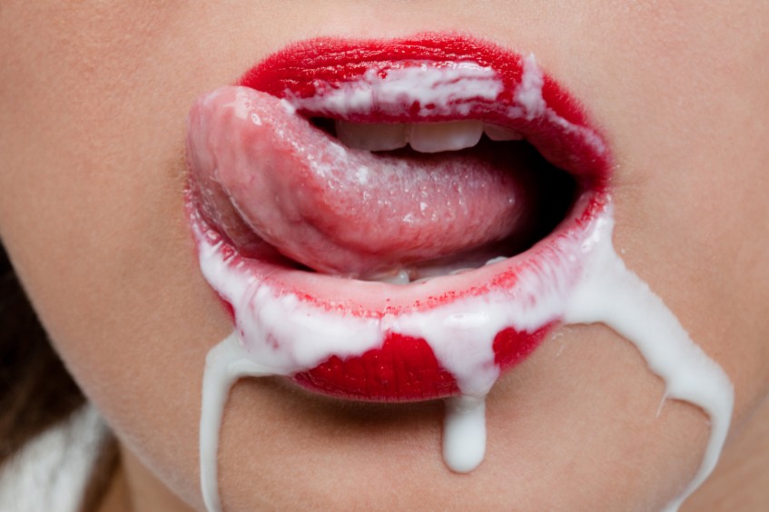 Woman with cream around her mouth