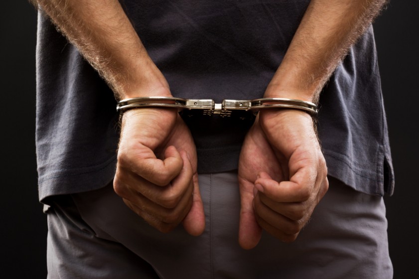 Man arrested wearing handcuffs