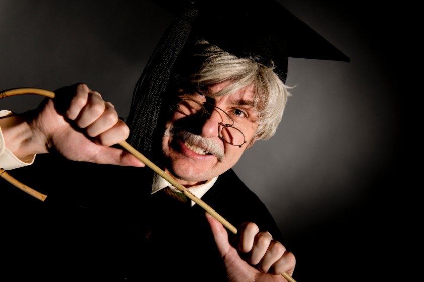 Headmaster holding cane