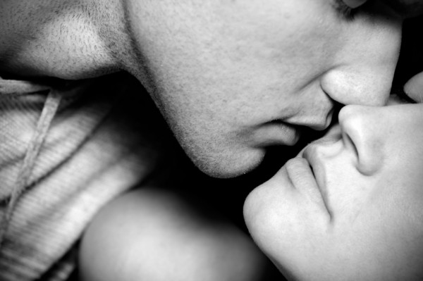 Black and white image of couple kissing