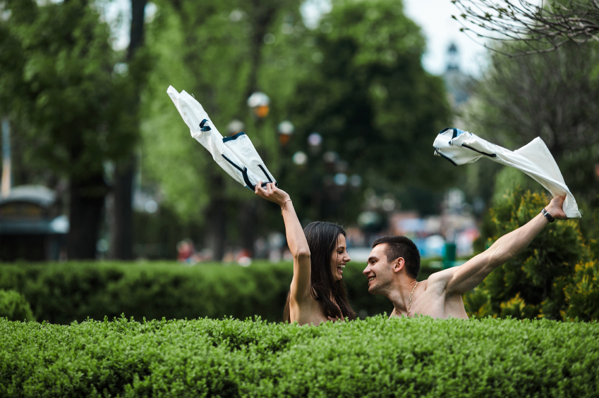 Couple undress in a European city