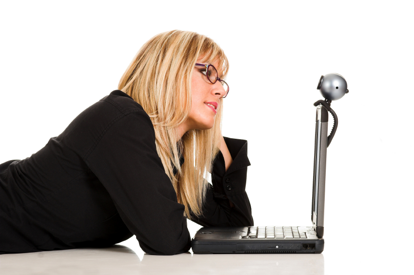 Woman looks at laptop with Skype