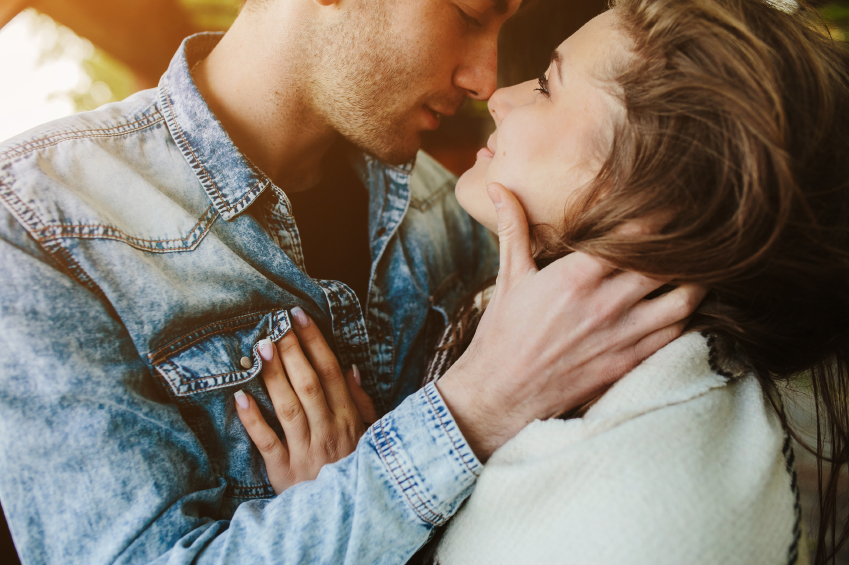 Man and woman about to kiss