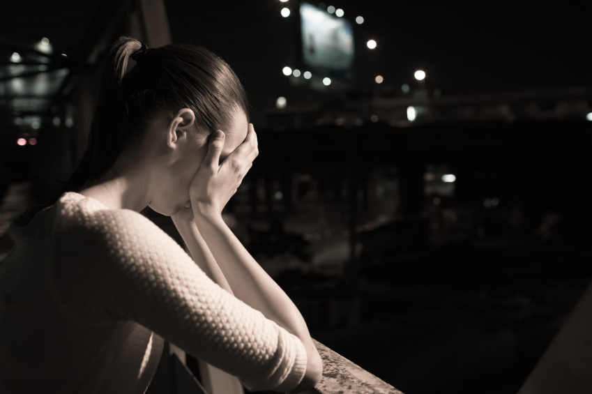 Woman sat down looking sad