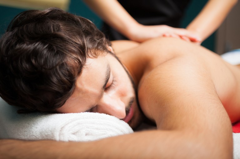 A man getting a massage off an escort