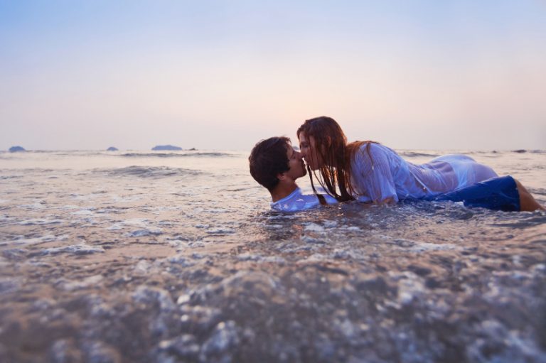 Couple having sex on the beach