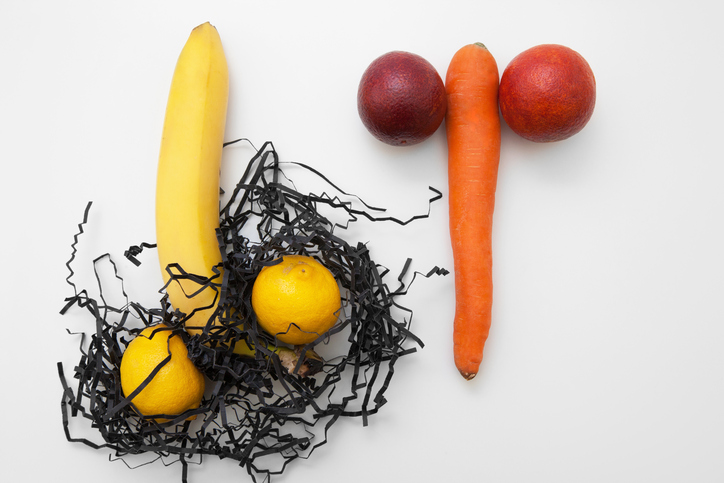 Sex, strong erection. Two man penis with shaved and unshaved eggs on white background, flat lay.