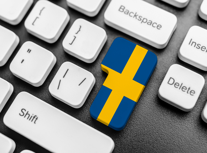 Enter key button with Flag of Sweden. Close-up.