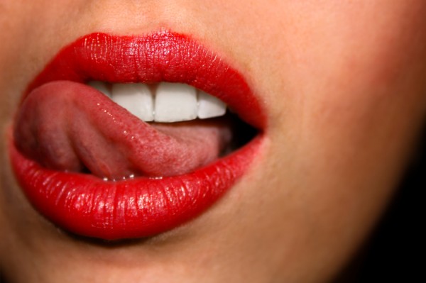 Sexy woman licking lips
