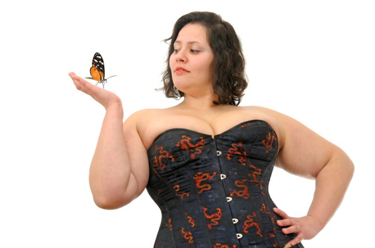 Beautiful large woman with butterfly isolated in white