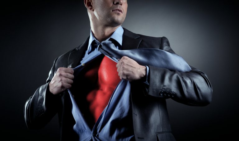 A man opening shirt to reveal superhero costume